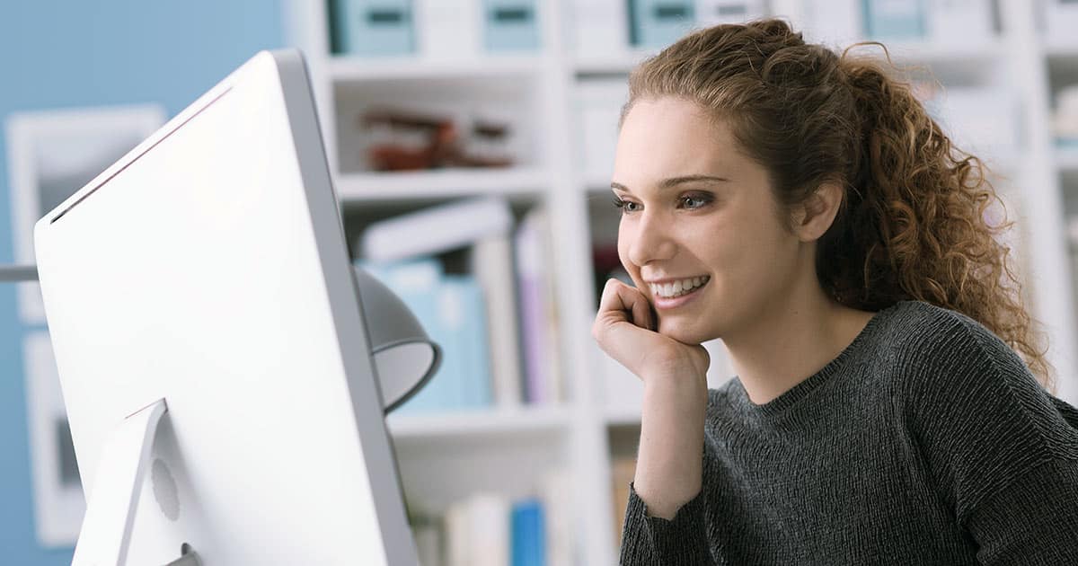 Woman enjoying working on a computer