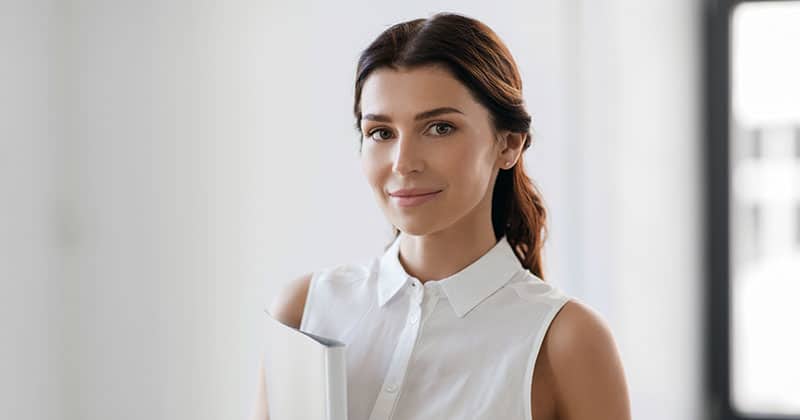 Professional woman holding a binder