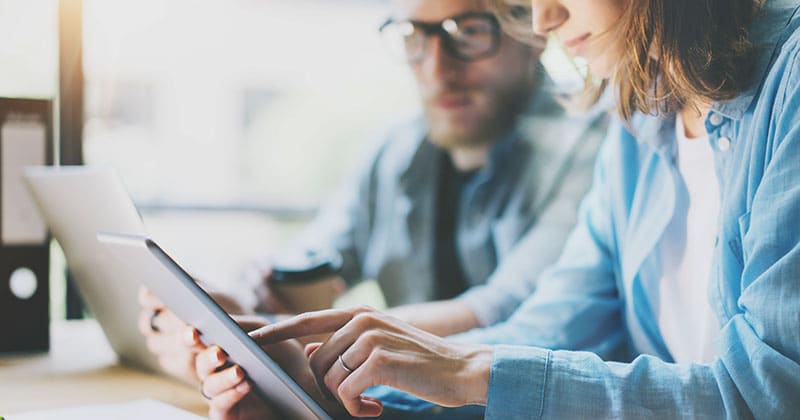 People collaborating while each using their own computer tablet