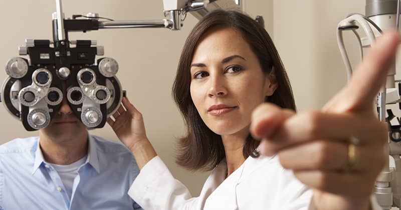 Optometrist testing a patient