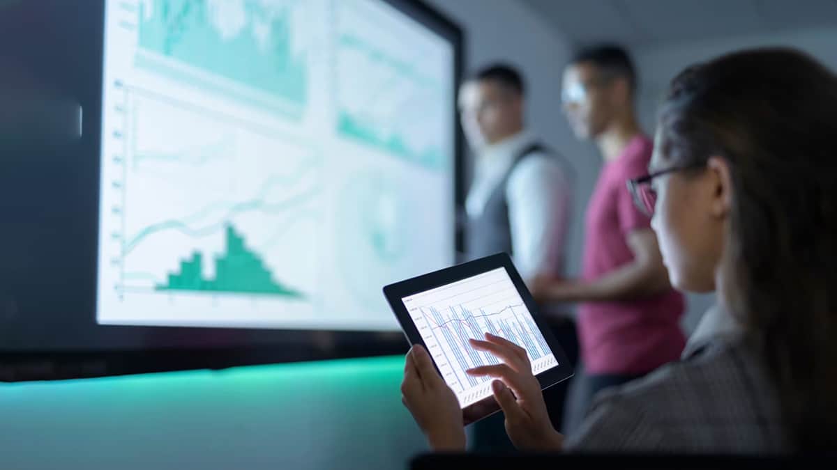 Professionals analysing data together